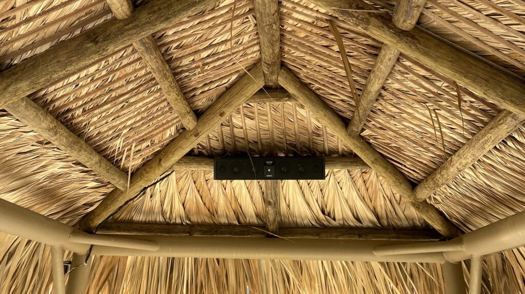 Thatched roof and sound system on the boat.